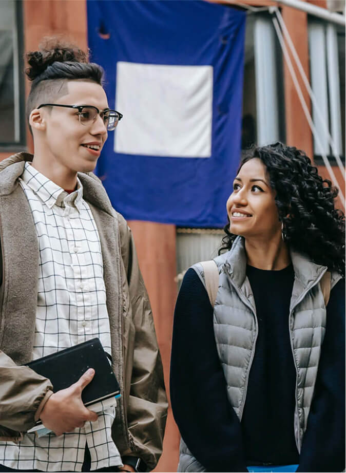 Two Teenagers Smiling at Each Other