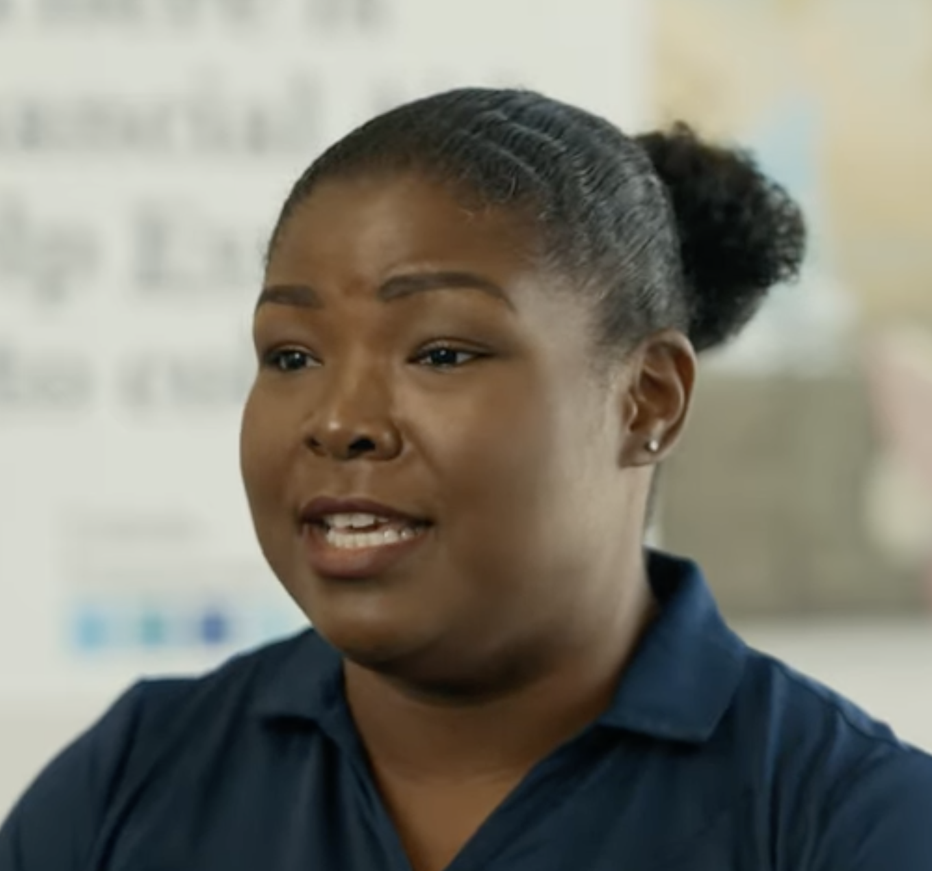 Kenda speaking to the camera for an interview